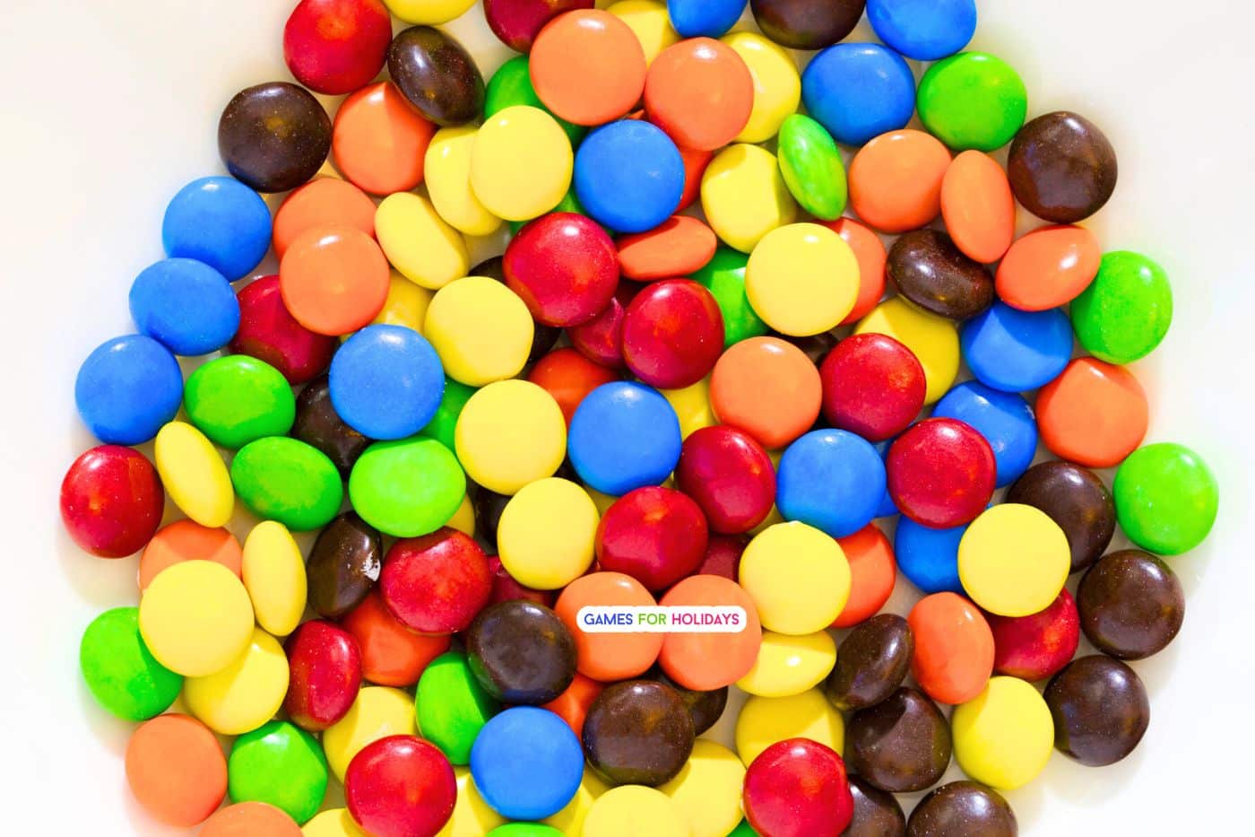 bowl of M&M candies on a Thanksgiving table for the candy Thanksgiving gratitude game for Thanksgiving games