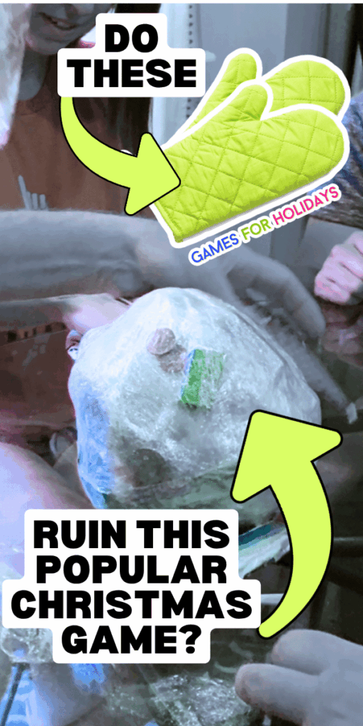 party guests playing Christmas plastic wrap ball game with oven mitts Christmas game at a Christmas party
