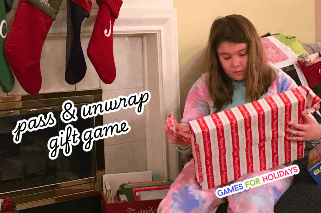 party guest unwrapping a Christmas box at a Christmas party with text overlay Pass And Unwrap Christmas Gift Game