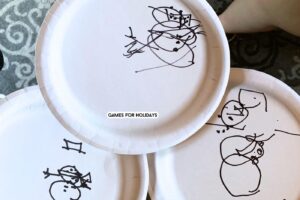 different snowmen drawings on paper plates for the Christmas Draw A Snowman Game for Christmas party games