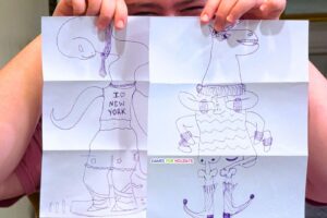 party game player holding up two funny drawings for the Exquisite Corpse Drawing Game for games for holidays